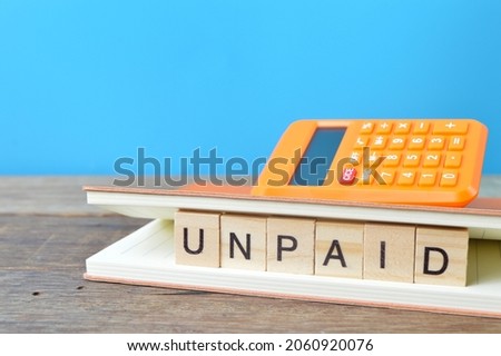 Square letters with text UNPAID. Business concept Royalty-Free Stock Photo #2060920076