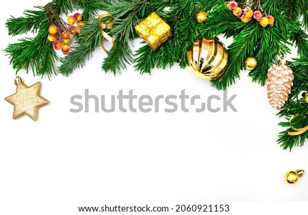 Christmas garland isolated on white background. New Year's decor in the form of green spruce branches, yellow balls, cones, stars. Festive concept. Mockup