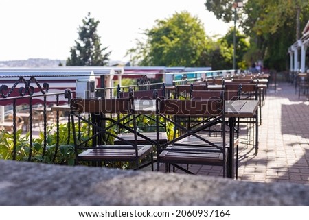 cafe, table and chairs stand in a recreation area