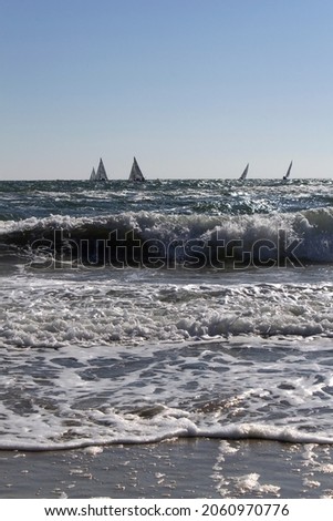 Sailing boats on sea water horizon  into stormy day  