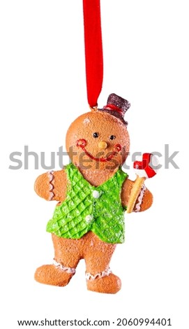 Gingerbread man in green vest isolated on white background.