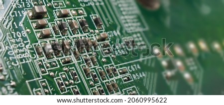 Semiconductor. cpu chip located on the green motherboard of the computer. Semi conductor motherboard circuit board. Hightech computer board with manufacture chip pcb technology. Smart phone iot chip. Royalty-Free Stock Photo #2060995622
