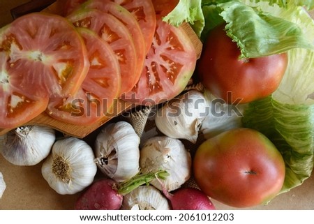 meal of tomatoes lettuce and mushrooms on table