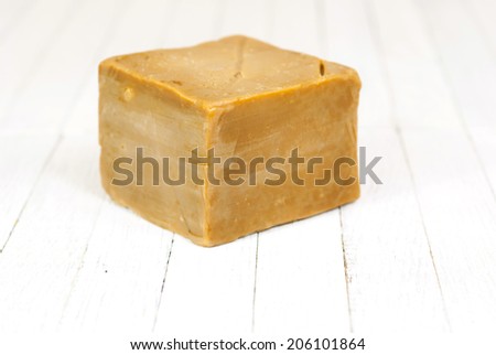 soap cube on white wood table