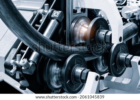industrial device for bending of metal pipes and plates,  industrial concept Royalty-Free Stock Photo #2061045839
