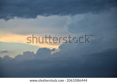 Cloudy sky right before a rainfall at sunset seen up close