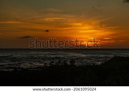 SUNSET FROM POI PU BEACH ON KAUAI HAWAII
