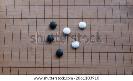 Play the Asian board game "Go".
