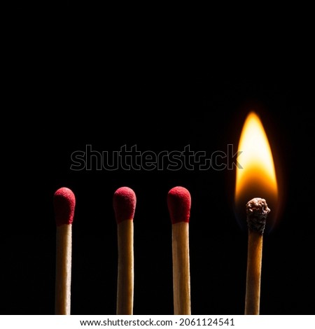 Burning matches flame, black border background high resolution image