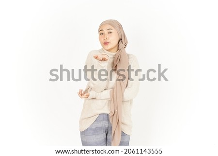 Blowing Kiss of Beautiful Asian Woman Wearing Hijab Isolated On White Background