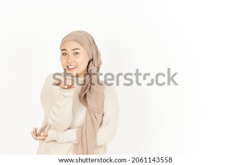 Blowing Kiss of Beautiful Asian Woman Wearing Hijab Isolated On White Background