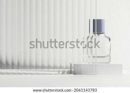 Pattern glass product backdrop with perfume bottle Royalty-Free Stock Photo #2061143783