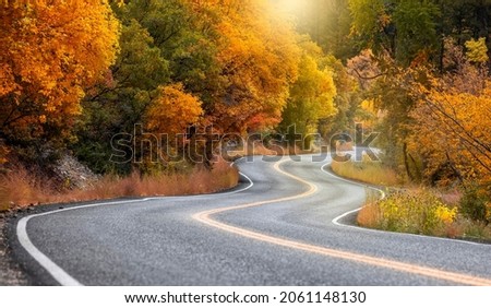 Scenic winding byway Alpine loop in Utah surrounded with brilliant fall foliage