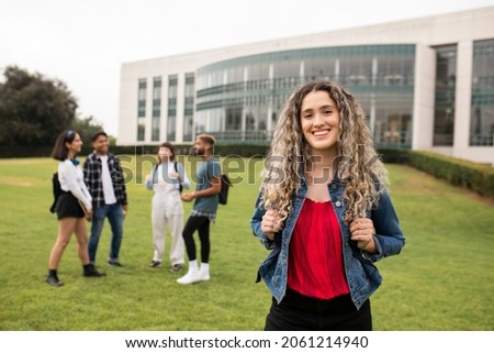 Happy exchange student at American university Royalty-Free Stock Photo #2061214940