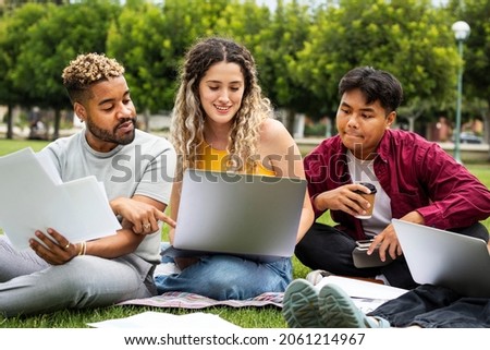 Students studying together outdoors at the campus