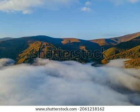 aerial landscape view of autumn carpathian mountains sunny day copy space white clouds under