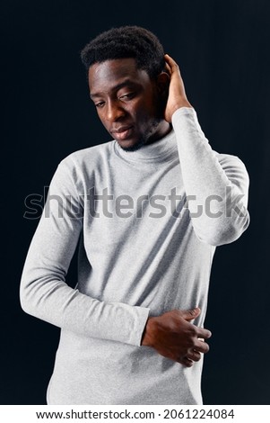 African American in gray sweater gesturing with hands fashion isolated background
