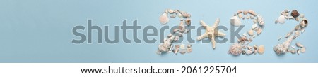 The banner numbers 2022 are lined with shells on a light blue background. Themed marine New Year greeting card for the holiday. Ecodesign. Minimalism.