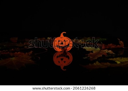 Silhouette Halloween pumpkin on a black background.
