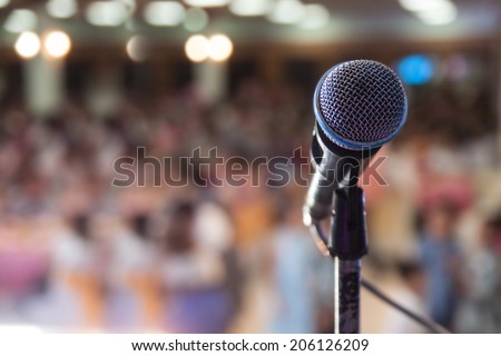 Close up of microphone in concert hall or conference room Royalty-Free Stock Photo #206126209