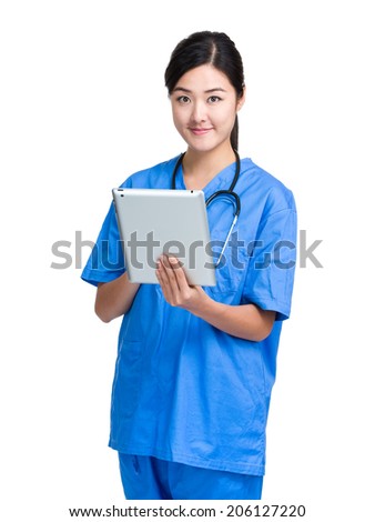 Asian Female Doctor using tablet
