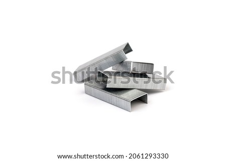 Close up stack of metal staples for stapler on a white background Royalty-Free Stock Photo #2061293330