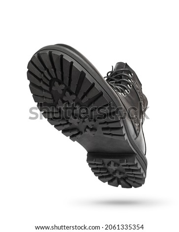 Black boots isolated on white. Steel cap leather boots isolated on white. Black combat men boot, black Military boots at Through use.  Royalty-Free Stock Photo #2061335354