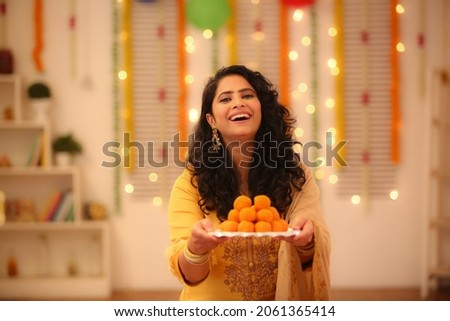 young female celebrating diwali with full of happiness  Royalty-Free Stock Photo #2061365414