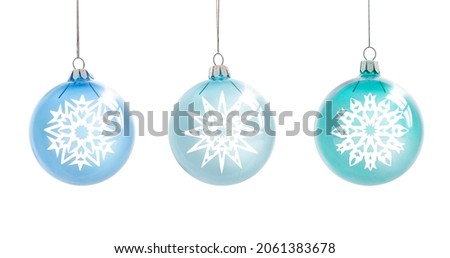 Beautiful glass Christmas balls with snowflakes