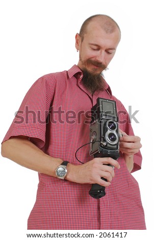 photographer with vintage double-lens reflex medium format  camera while working in studio isolated on white background