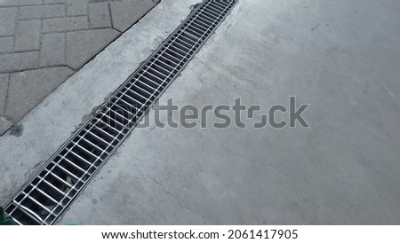 sewer on public roads with iron grating