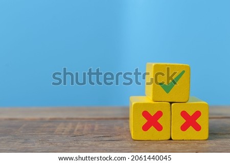 Wooden blocks with correct sign and incorrect signs. Best decision concept