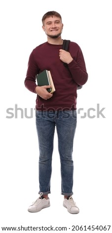 Young student with backpack and books on white background