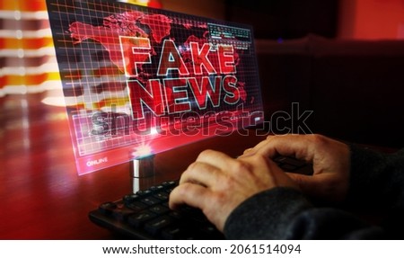 Fake news on computer screen. Broadcast, trolling, false information, hoax, propaganda, information and disinformation abstract concept 3d with glitch effect. Man typing keyboard. Royalty-Free Stock Photo #2061514094