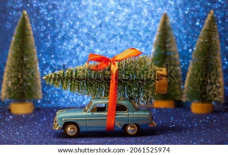  toy car with a Christmas tree on the roof. Christmas background. Christmas or New Year. Copy space