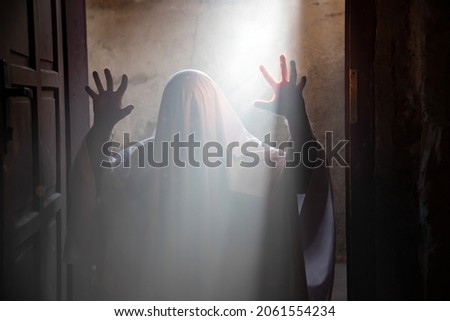 Scary ghost in dark, spooky halloween night