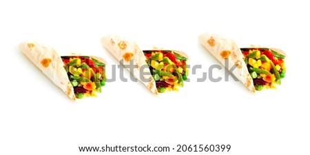Mexican tortilla with vegetable and mushroom fillings on white background. Healthy eating concept or eat less meat.