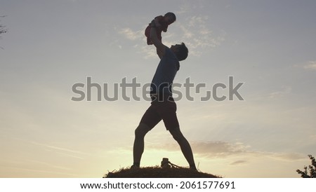 A man with a child. The state of being a father, fatherhood. Determining paternity without a DNA test. Royalty-Free Stock Photo #2061577691