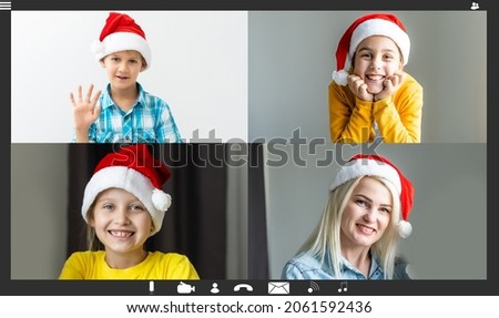 Christmas online family congratulations. Smiling kids using laptop for video call relatives, making x-mas eve skype video meeting conference waving arms congratulating relatives