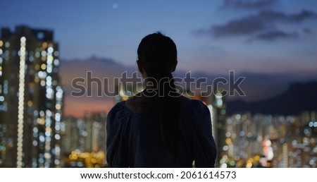 Woman look at the Hong Kong city
