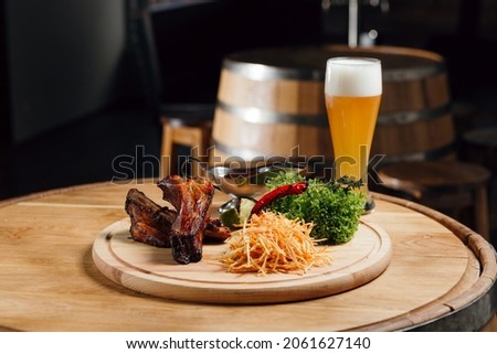 A plate with snacks for beer for friends in a pub