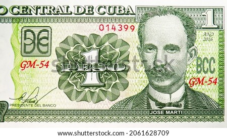 1 Peso banknote, Bank of Cuba, closeup bill fragment shows Jose Marti and face value, issued 2016
