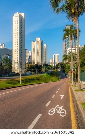 Curitiba, Parana, Brazil - September 27th 2021 - Urban scenes of city road with modern buildings in the background. Royalty-Free Stock Photo #2061633842