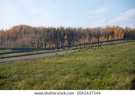 race track against the background of autumn trees