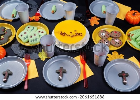 Halloween sweet appetizer kids table setting concept. toning. selective focus