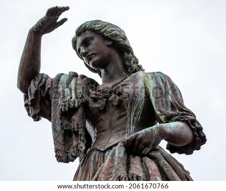 The statue of Flora MacDonald at Inverness Castle in Scotland - she helped Charles Edward Stuart evade government troops after the Battle of Culloden in 1746,. Royalty-Free Stock Photo #2061670766