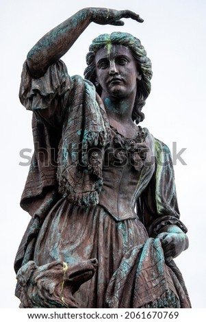 The statue of Flora MacDonald at Inverness Castle in Scotland - she helped Charles Edward Stuart evade government troops after the Battle of Culloden in 1746,. Royalty-Free Stock Photo #2061670769