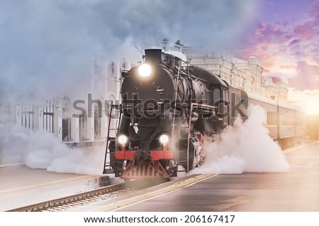 Retro steam train departs from the railway station at sunset. Royalty-Free Stock Photo #206167417