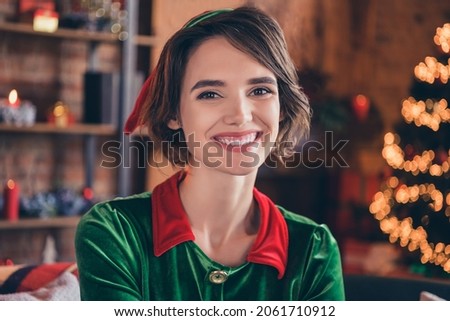 Portrait of attractive cheerful brown-haired girl wearing elf outfit look festal day at home modern loft industrial interior indoors