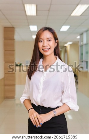 portrait of an Asian woman smiling. Vertical